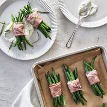 Green beans bundles with prociutto and herbs creamy sauce